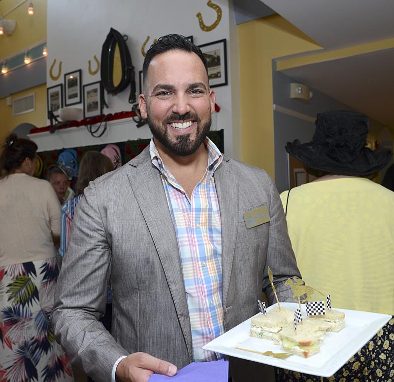 Sean Donovan, camp director, is on duty passing around cucumber sandwiches.